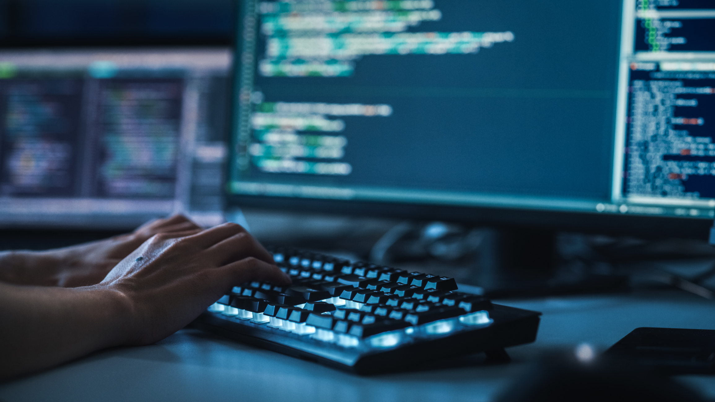 Human hands on computer keyboard